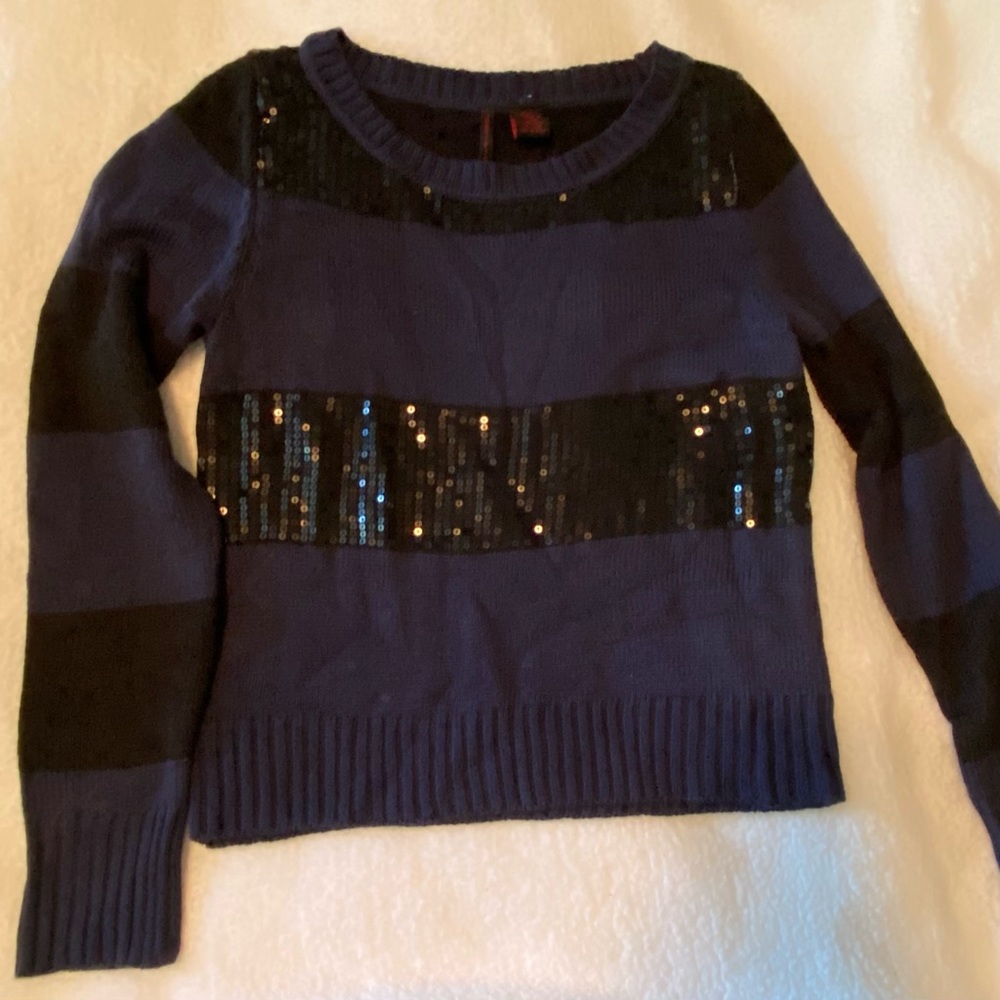Blue and black striped light sweater.